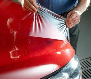 Applying paint protection film to front of hood